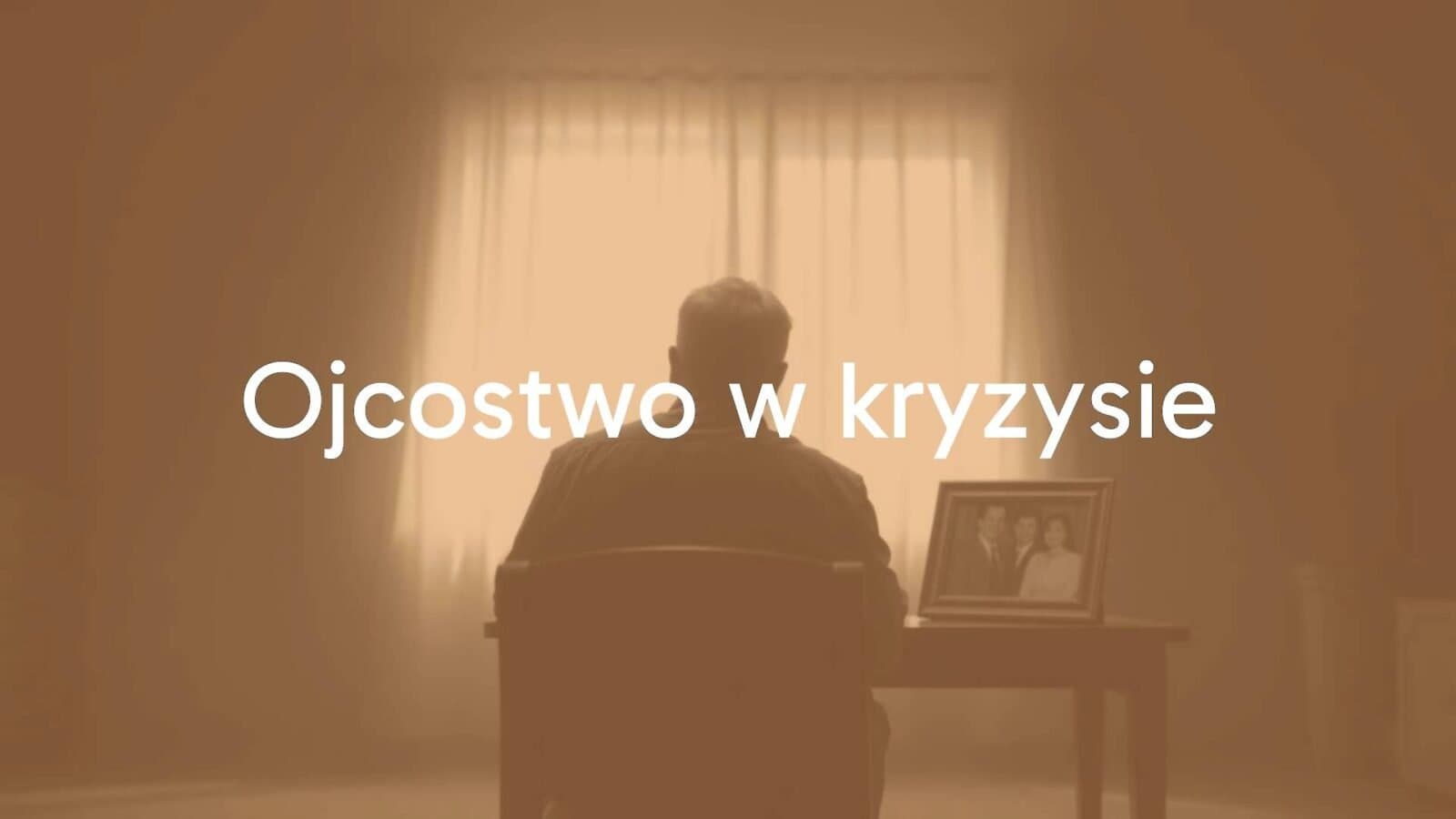 A distressed father sitting alone in a dimly lit room, looking thoughtful, blurred family photo on the table, muted colors, somber mood, realistic.