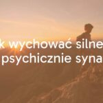 A young boy climbing a mountain with determination, sunrise in the background, representing mental resilience and growth, realistic.